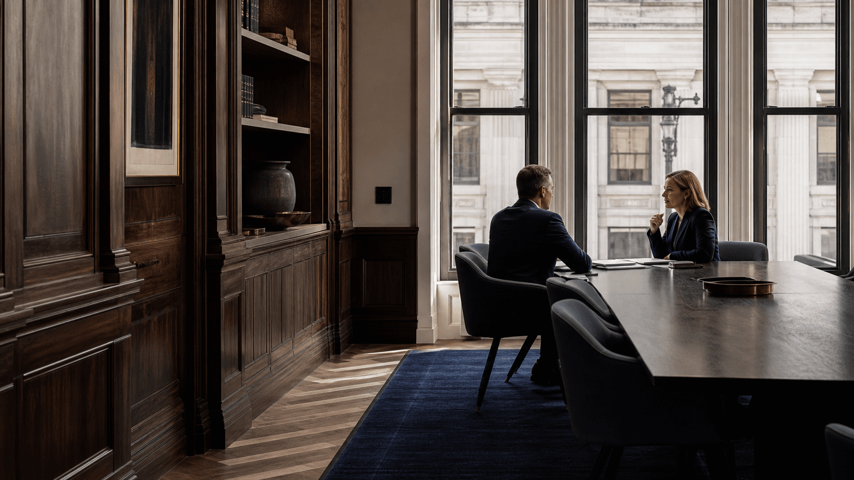 Elegant law office meeting room with attorneys in a quiet discussion