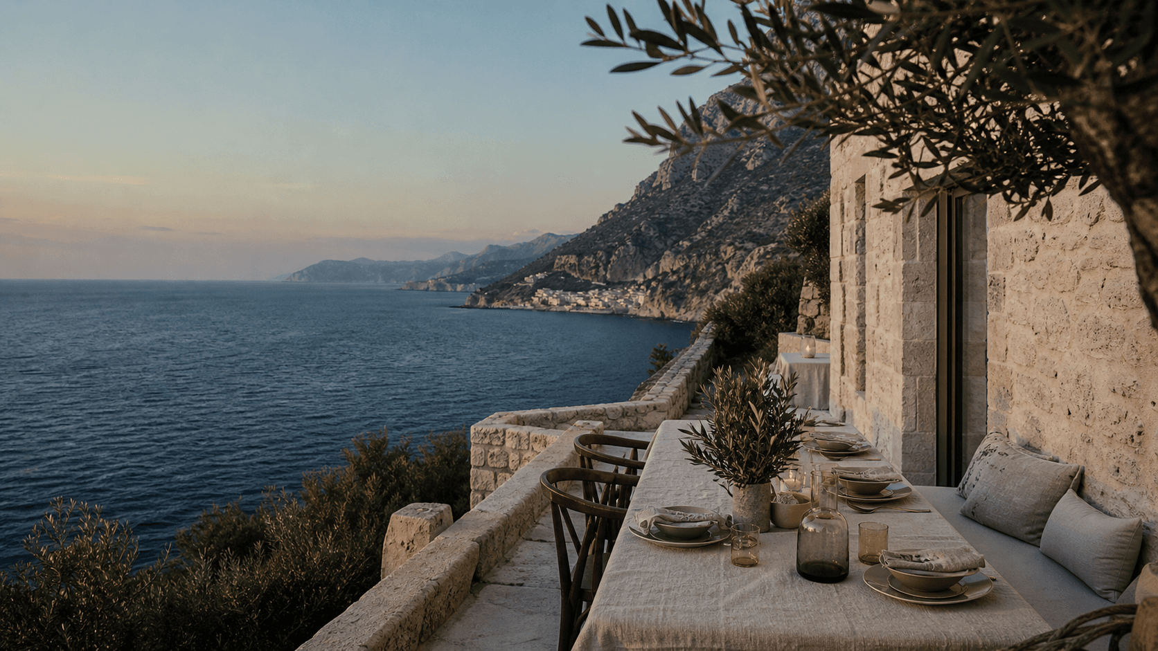 A secluded Mediterranean terrace overlooking the sea at early evening