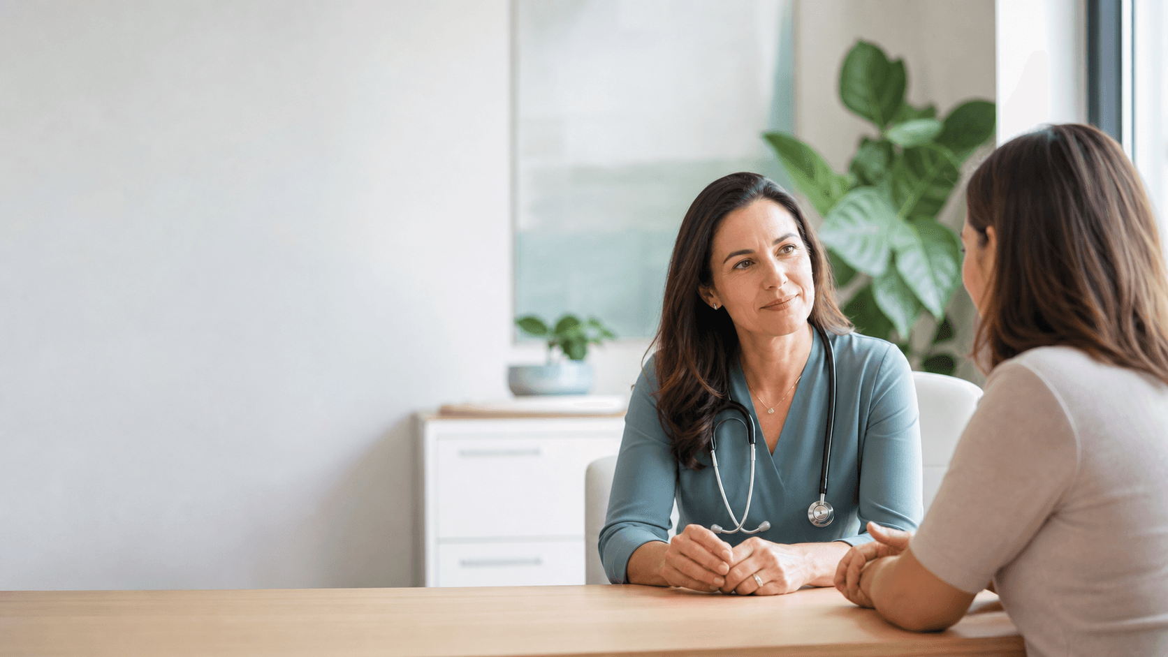 Physician having a calm consultation with a patient in a modern clinic